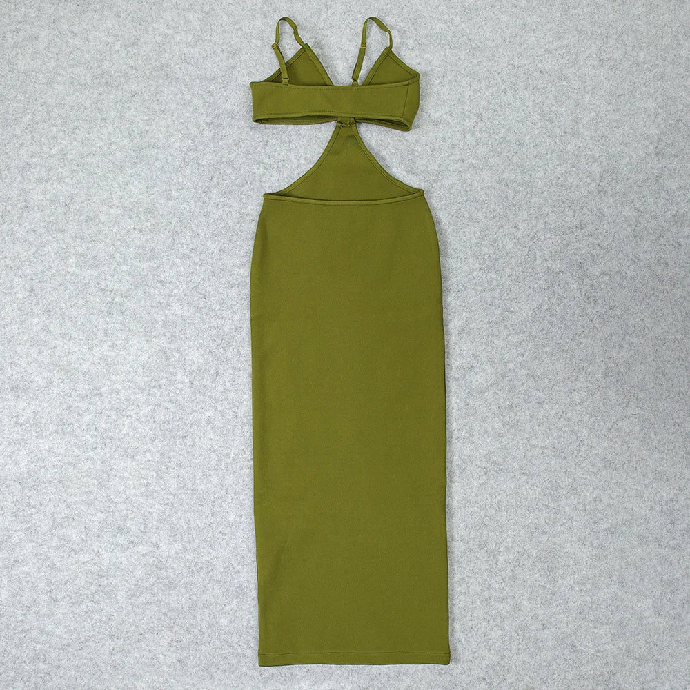 Green dress with thin straps on a textured gray background