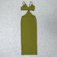 Green dress with thin straps on a textured gray background