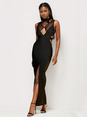 Woman wearing a black dress with cut-out design on a white background