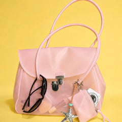 Pink transparent tote bag showing contents
