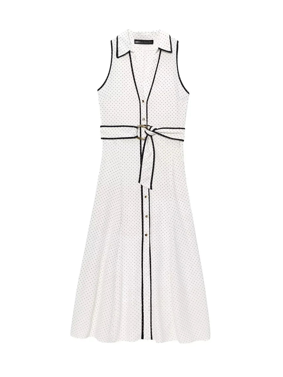 White sleeveless dress with black polka dot pattern
