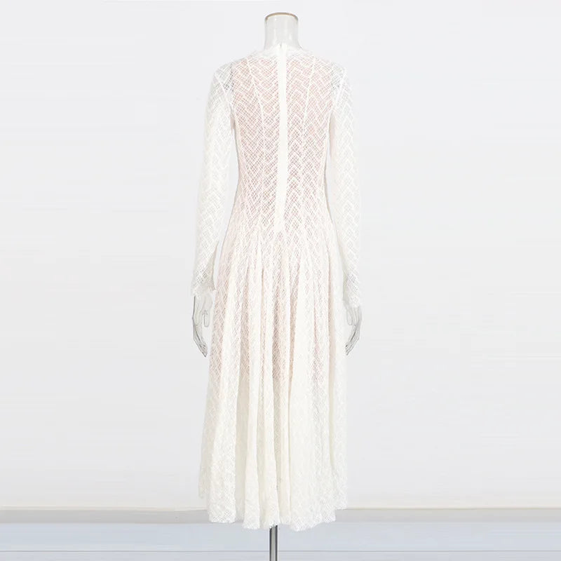 White lace dress on a mannequin against a white background
