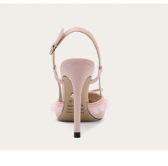 Pink high-heeled shoes with a strap on a white background