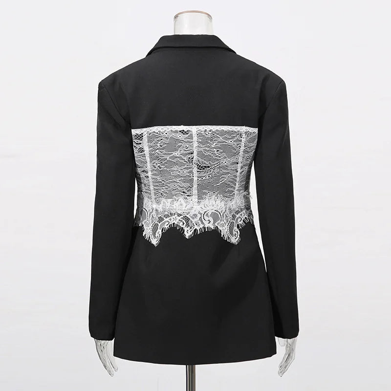 Black jacket with white lace detailing on a mannequin against a white background