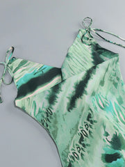 Green tie-dye swimsuit on a gray background