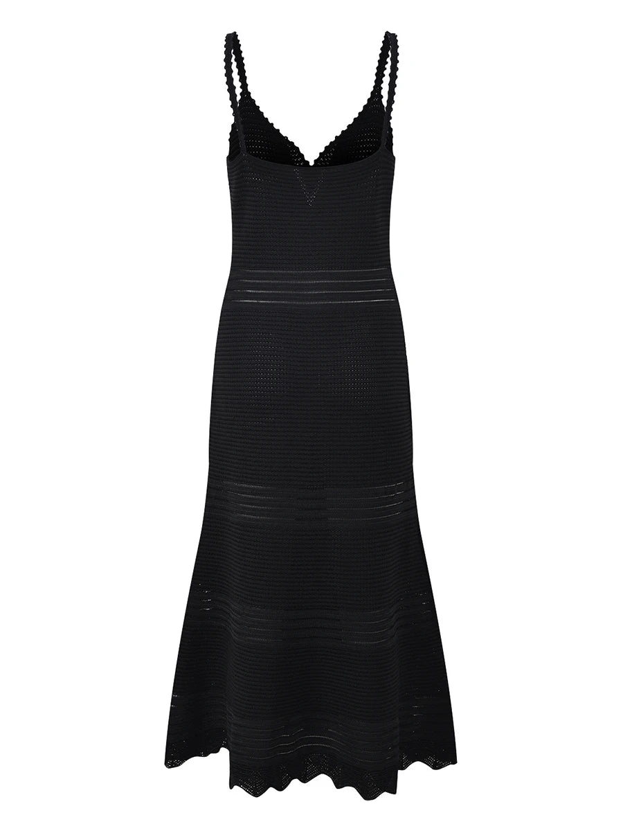 Back view of a black knit midi dress with a V-neck cutout and fishtail hem