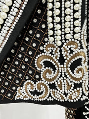 Detailed view of pearl and bead embroidery on cropped jacket