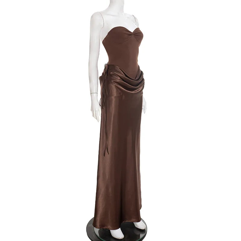 Brown strapless evening gown on a mannequin against a white background