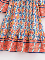 Close-up of the tiered hem on the mini dress