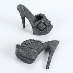 Pair of high-heeled shoes with buckles on a white background