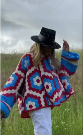 Geometric quilted kimono jacket worn outdoors.