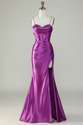 Purple evening gown on a mannequin against a plain background