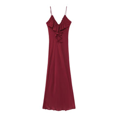 Red evening gown with ruffled details on a white background