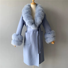 Light blue coat with fur trim on a mannequin against a plain background