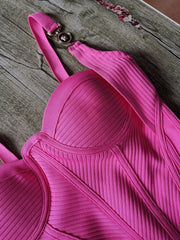 Pink bra on a wooden surface