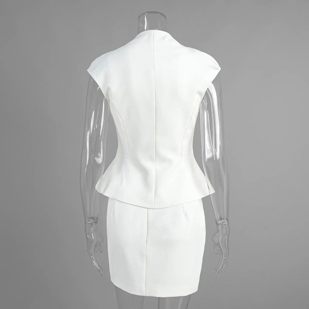 White dress on a mannequin against a gray background