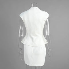 White dress on a mannequin against a gray background