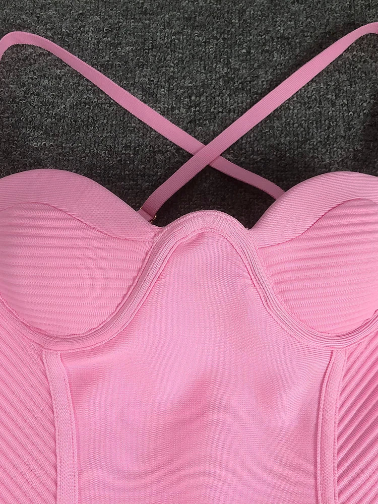 Pink sports bra on a dark textured background