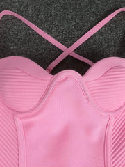 Pink sports bra on a dark textured background