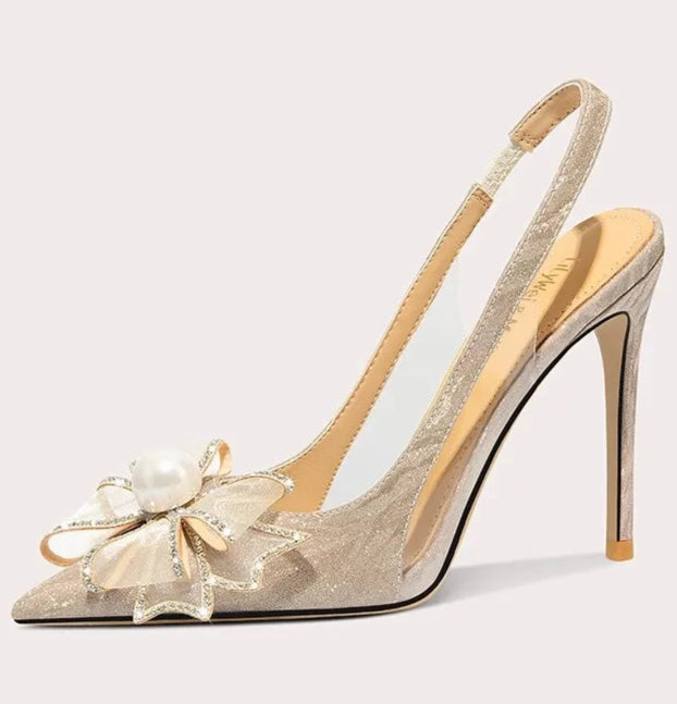 High-heeled shoe with floral design on a light gray background