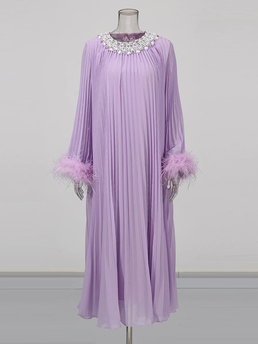 Lavender dress with embellishments on a mannequin against a gray background