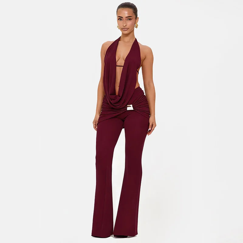 Burgundy jumpsuit with a plunging neckline on a white background