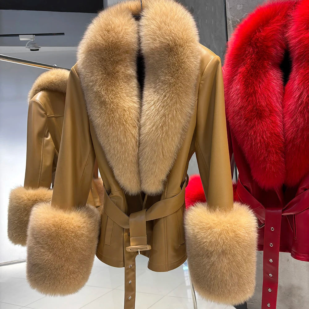 Tan leather coat with fur collar and cuffs next to a red coat with fur trim in a store setting.