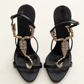 Black stiletto heel with gold scorpion embellishment and crystal details