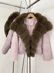 Pink puffer jacket with brown fur trim on a hanger against a white background