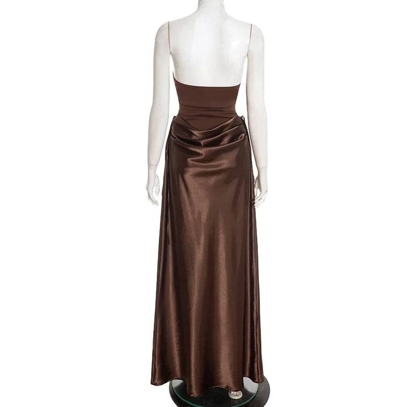Brown evening gown on a mannequin against a white background