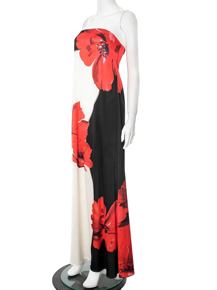 Mannequin wearing a black dress with red floral patterns