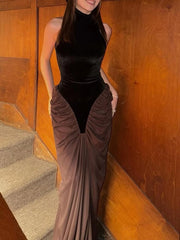 Turtleneck sleeveless draped ruched maxi dress on stairs