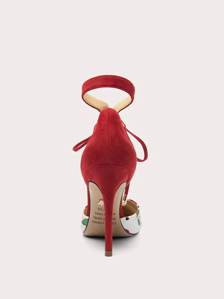 Red high-heeled shoe with a unique design on a white background