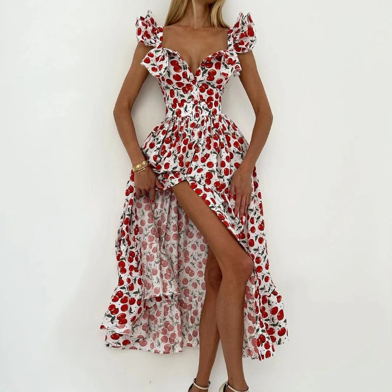 Woman wearing a red and white floral dress with a high-low hem on a white background