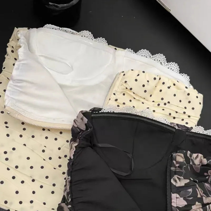 Three pieces of women's underwear with lace trim on a black surface.