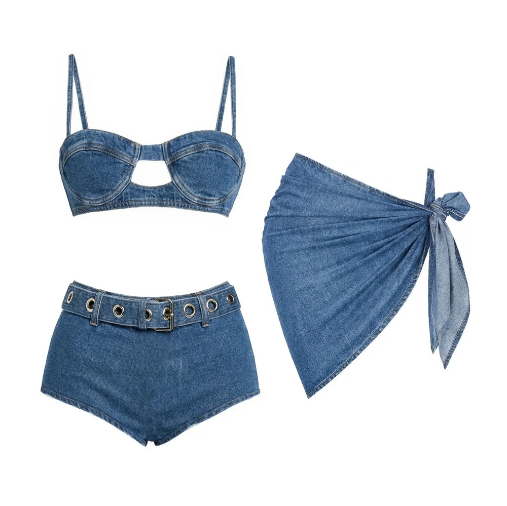 Denim print bikini top and high-waisted shorts with belt detail, paired with a wrap skirt.