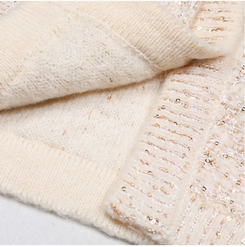 Close-up of a textured beige fabric on a light gray background