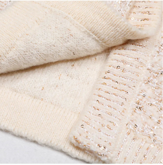 Close-up of a textured beige fabric on a light gray background