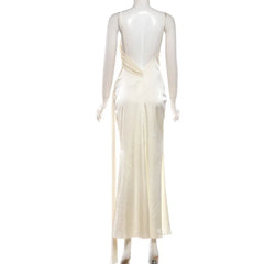 Mannequin wearing a cream-colored evening gown on a white background