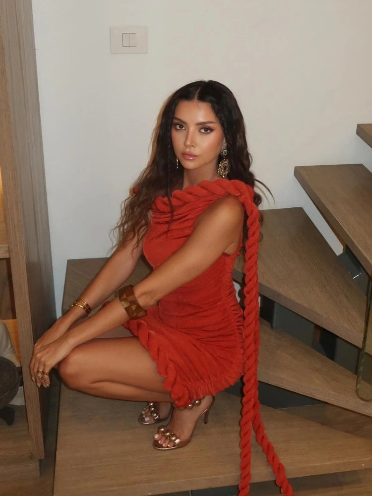 Red sheath mini dress shown in a sculpted, evening-ready silhouette