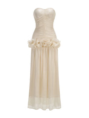 Beige strapless gown with floral details on a white background