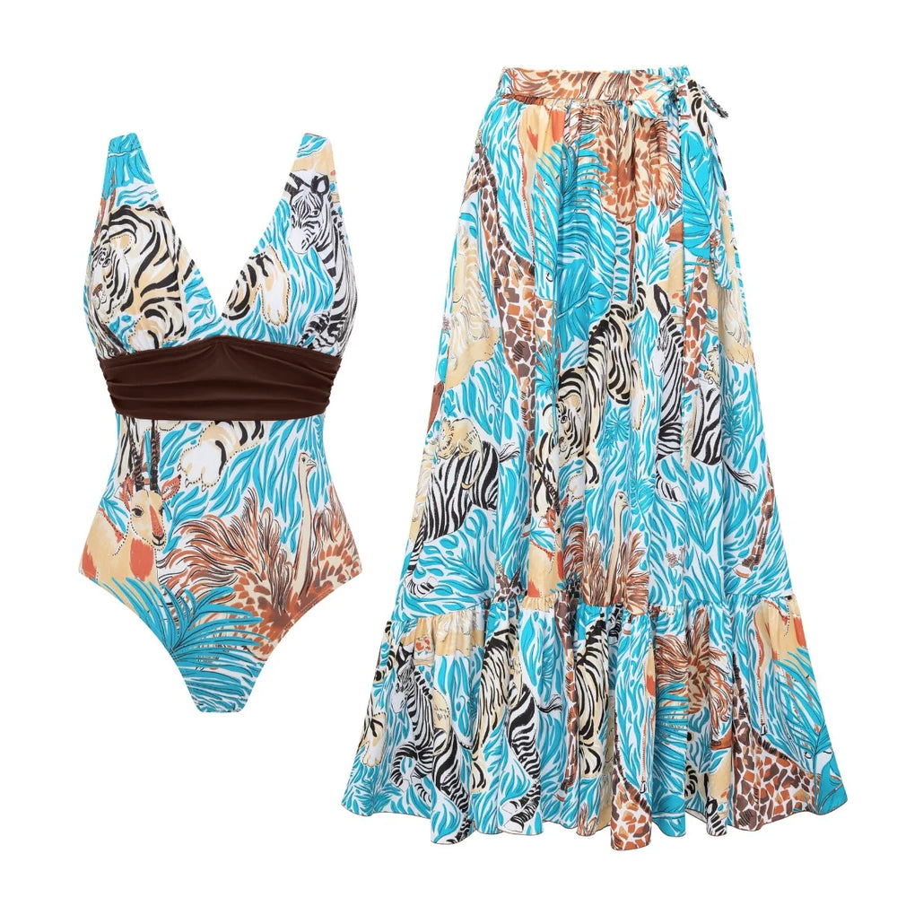 Woman wearing a print halter neck one-piece swimsuit and tiered maxi skirt on a beach