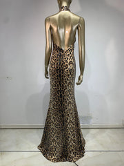 Mannequin wearing a leopard print dress against a plain background
