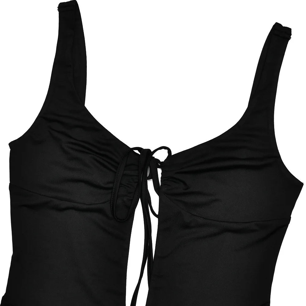 Black swimsuit top with thin straps on a white background