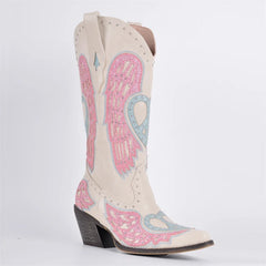 White cowboy boot with pink and blue embroidery on a white background