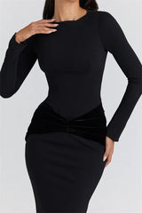 Black long-sleeve top and pencil skirt set on a plain background
