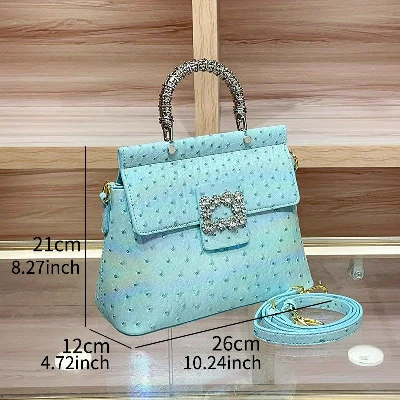 Dimensions of the blue ostrich print textured handbag, showing height, width, and depth.