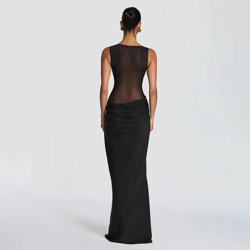 Black evening gown with sheer back on a white background