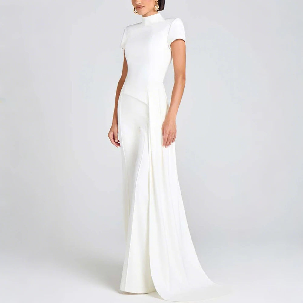 White evening jumpsuit on a plain background
