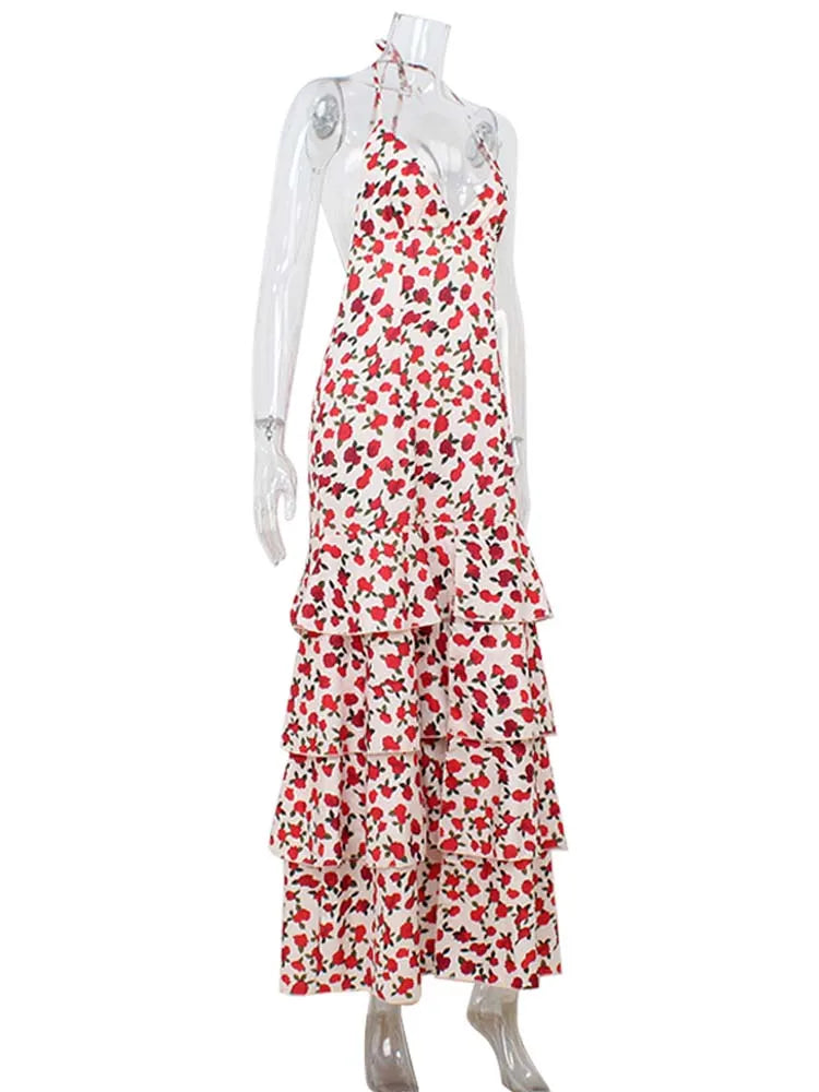 Red and white floral dress on a mannequin against a white background